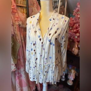 White blouse with heart pattern